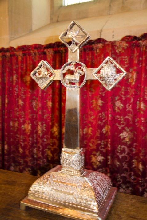 An ornate cross sits on the altar at St. John's Church, Ladywood.