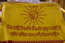 A religious banner decorating the altar at the Gudwara. It signifies that there is only one God.