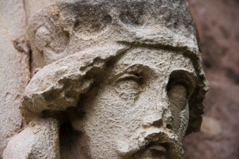 The carved-and now quite weathered-face of a king decorates the exterior of St. John's Church, Ladywood.