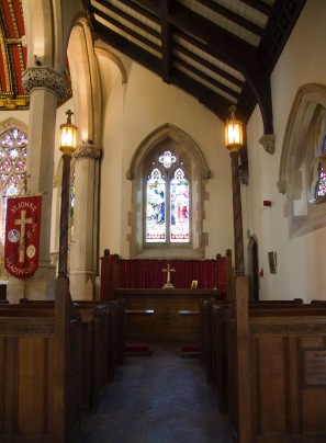Side chapel altar, with traditional pews facing it at St. John's Church, Ladywood.