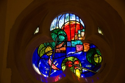 A contemporary stained glass window at St. John's Church, Ladywood. It presents a stylised vision of the Holy Land